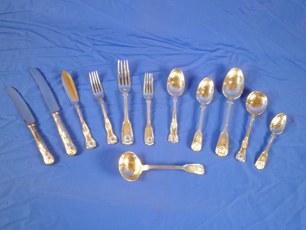 Appraisal: A set of silver fiddle thread and shell pattern cutlery