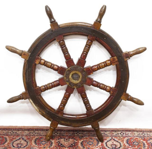 Appraisal: Large metal-mounted ship's wheel remnants of painted finish approx diam