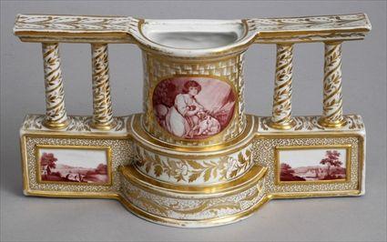 Appraisal: ENGLISH PORCELAIN BASE The bowed stepped center with puce oval