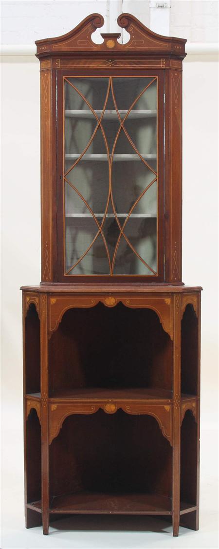 Appraisal: An Edwardian mahogany inlaid double corner cabinet the swan neck