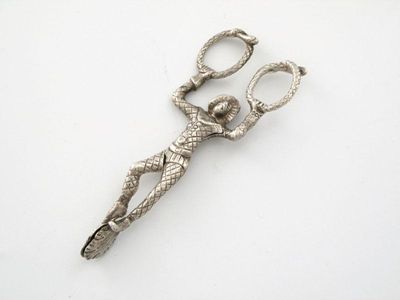 Appraisal: A pair of electroplated novelty harlequin sugar tongs with snake