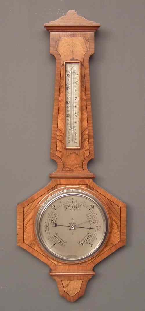 Appraisal: A s walnut cased aneroid barometer and thermometer with ins