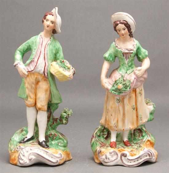 Appraisal: Pair of Staffordshire painted earthenware figures th century modeled as