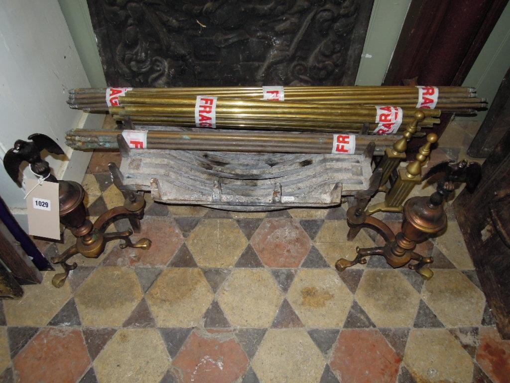 Appraisal: A cast iron fire grate and brass dogs with eagle