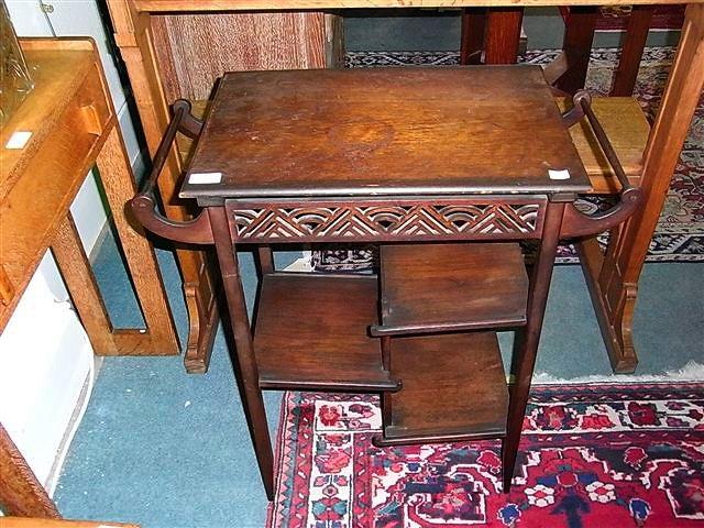 Appraisal: A GODWIN STYLE SIDE TABLE with pierced frieze on tapering