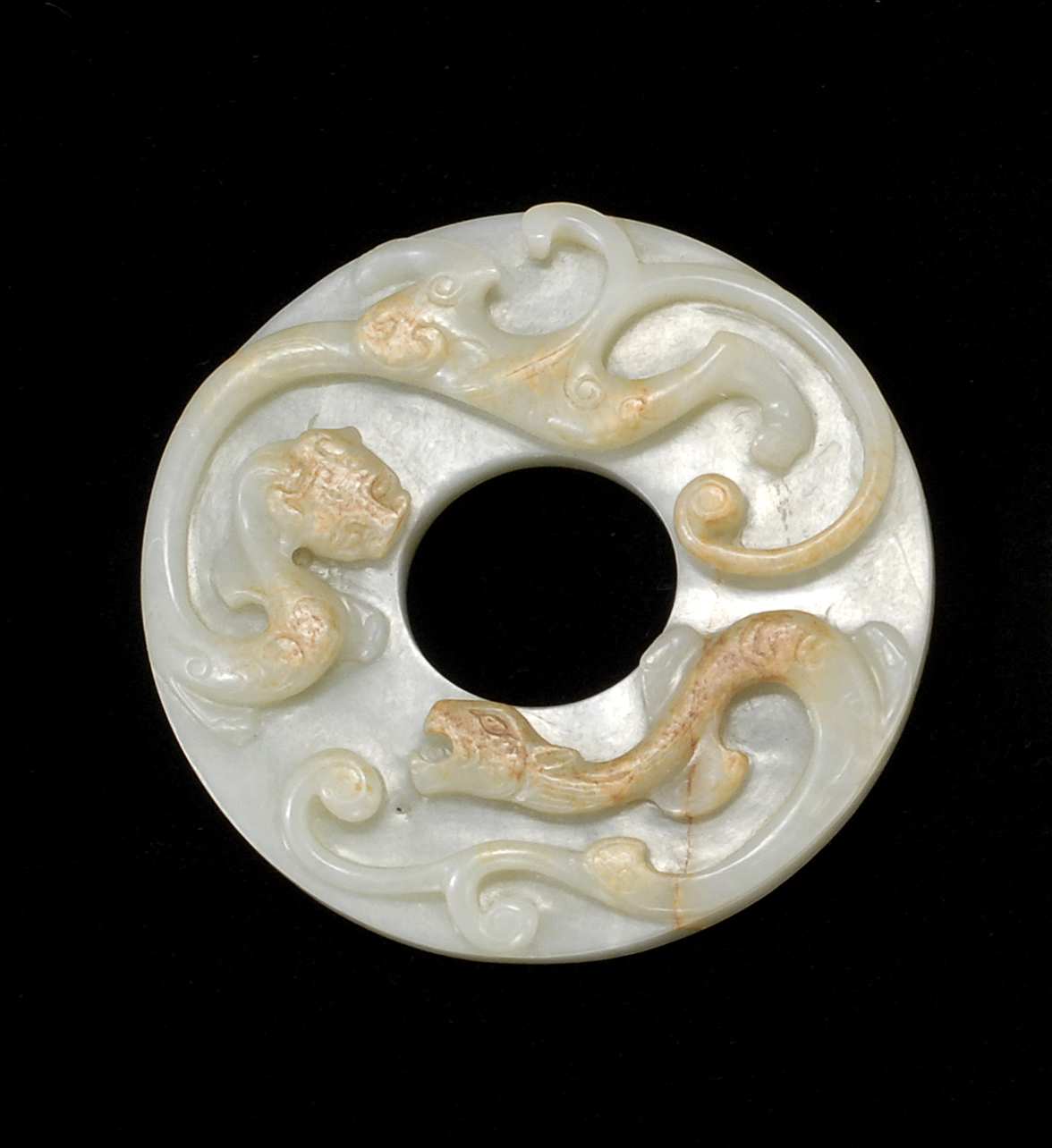 Appraisal: CELADON AND RUSSET JADE BI th CenturyWith relief qilong dragons