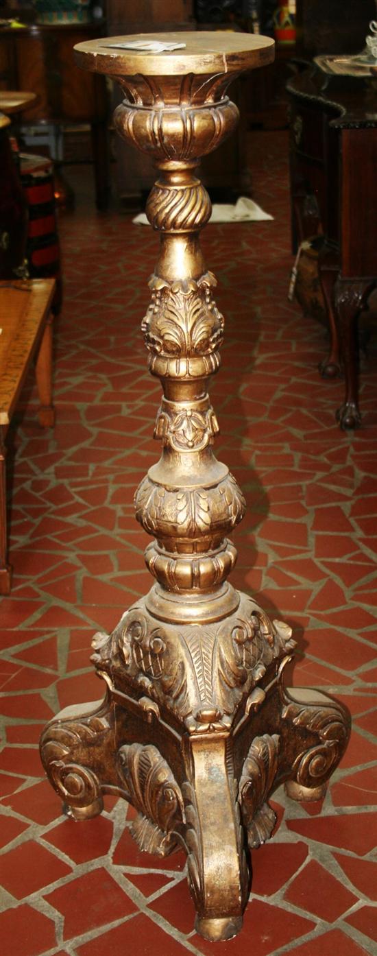 Appraisal: Pair Continental carved giltwood torcheres fluted outswept top on baluster-turned