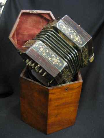 Appraisal: Victorian Rosewood Accordian tooled green leather with gold highlights carved