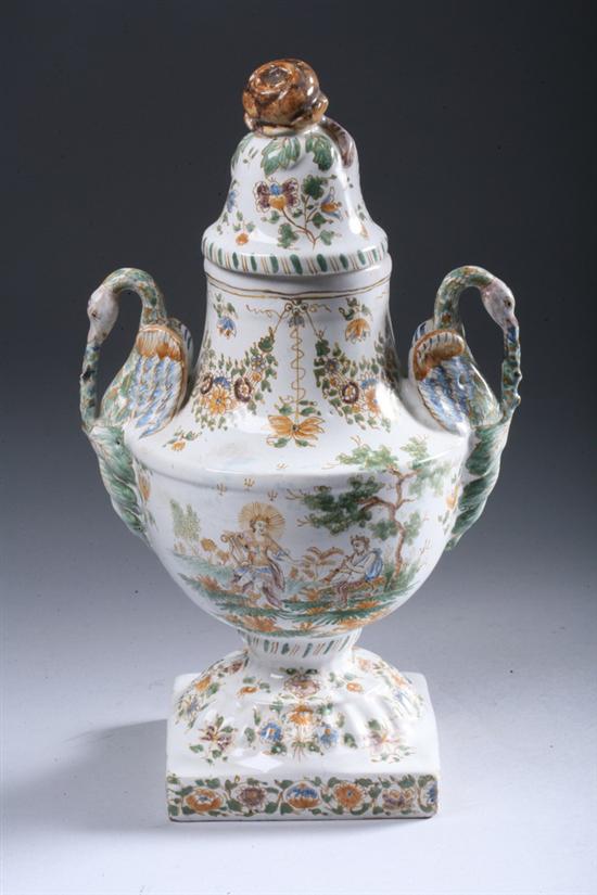 Appraisal: MOUSTIERS FA ENCE COVERED VASE th century Urn-form with swan