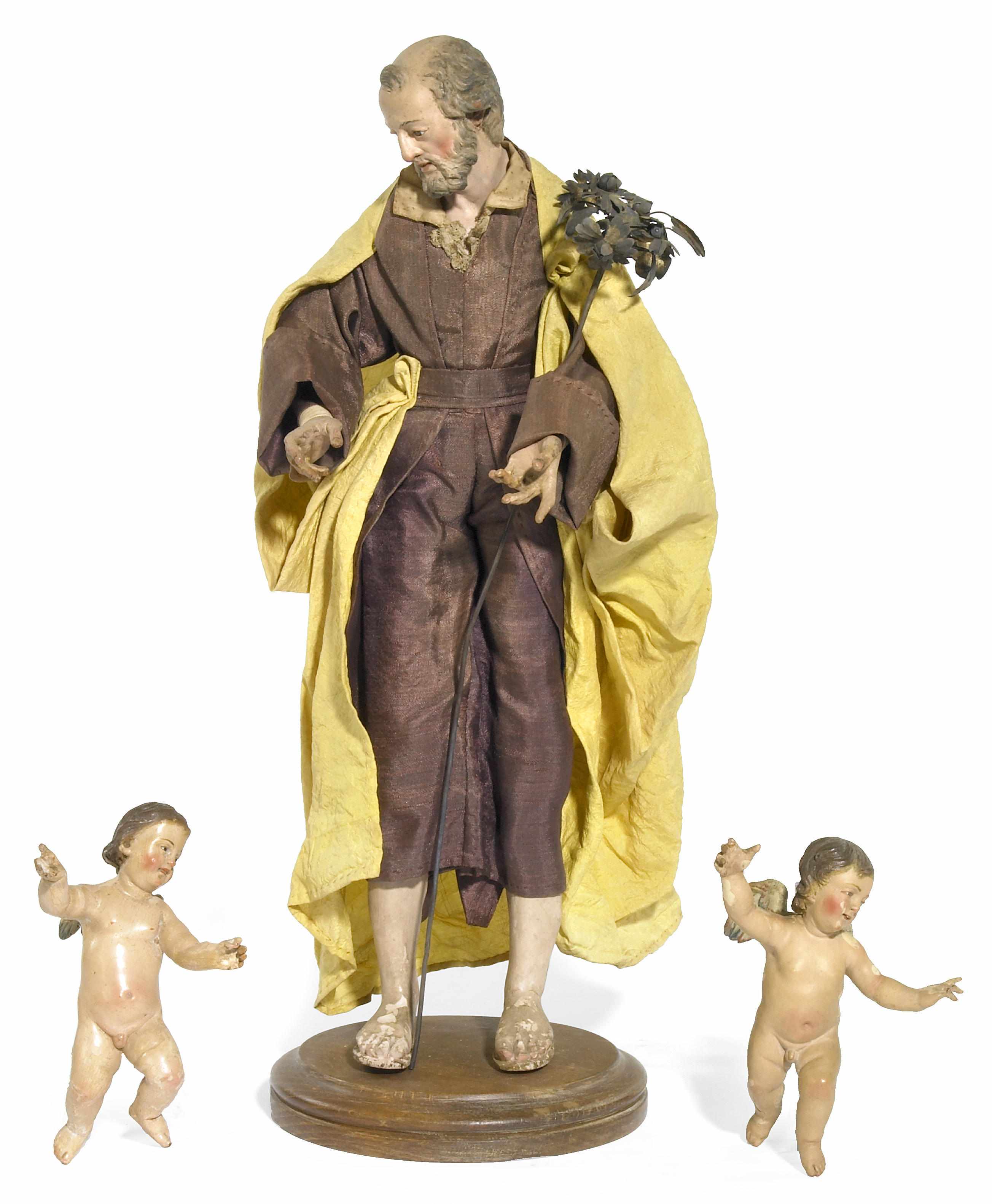 Appraisal: An Italian crche figure of a man and two putti