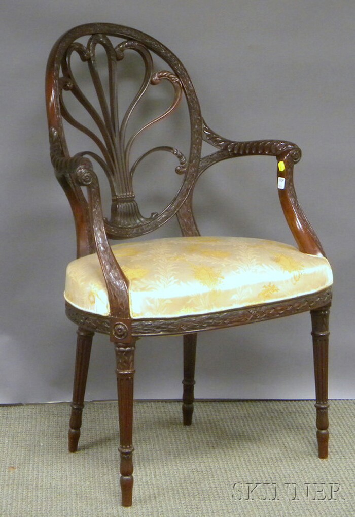 Appraisal: J S Henry Ltd Georgian-style Upholstered Carved Mahogany Armchair London