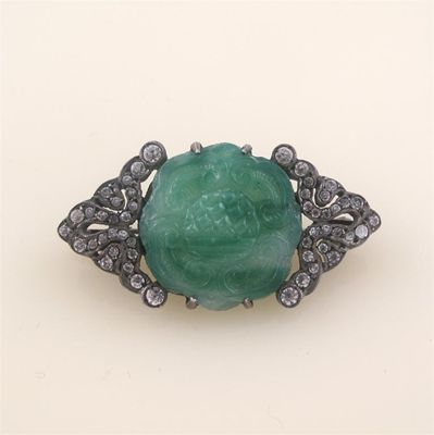 Appraisal: A jade and paste set silver coloured metal brooch cm