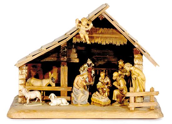 Appraisal: Italian nativity scene carved wood manger with eleven painted composition