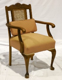 Appraisal: A th century stained beech and upholstered armchair