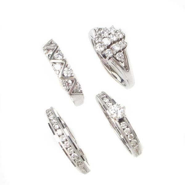 Appraisal: A collection of four diamond and white gold rings four