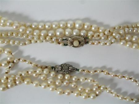 Appraisal: A graduated double strand cultured pearl necklace with a pearl