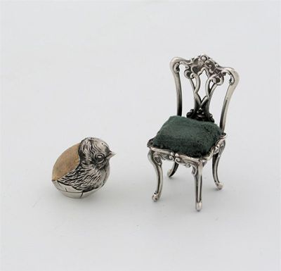 Appraisal: An Edwardian chair pin cushion with an openwork back and