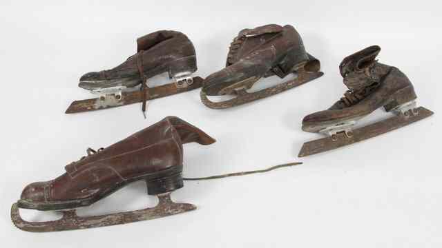 Appraisal: Two pairs of brown leather ice skates