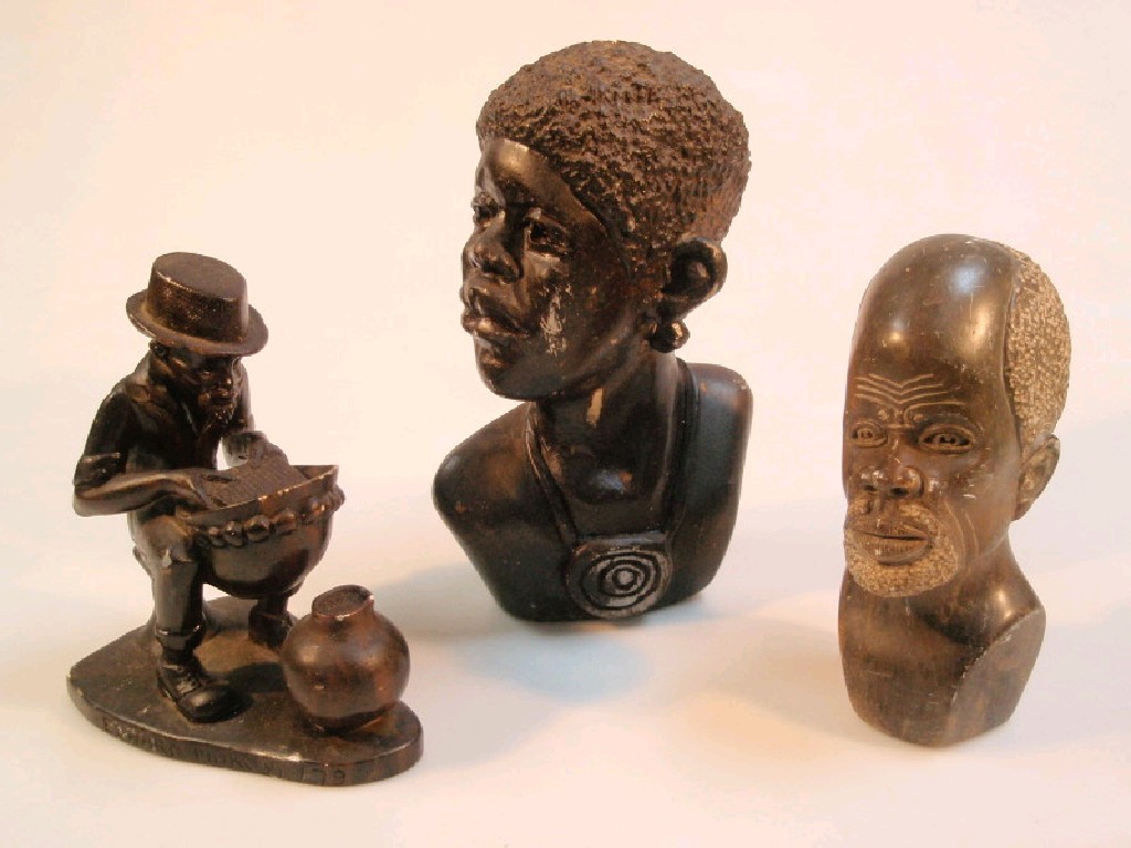 Appraisal: A group of three carved soapstone tribal figures cm down