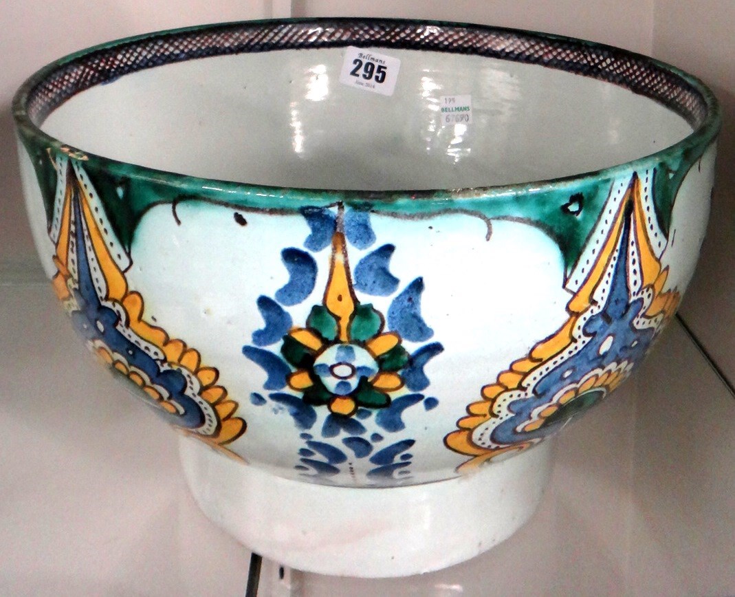 Appraisal: A North African pottery bowl late th century painted with