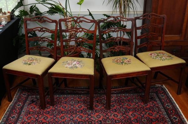 Appraisal: FOUR TH C CHIPPENDALE STYLE NEEDLEPOINT CHAIRSThe Chippendale style ribbon