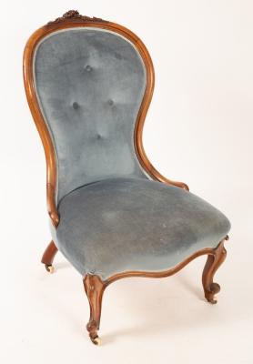 Appraisal: A Victorian fireside chair with button back