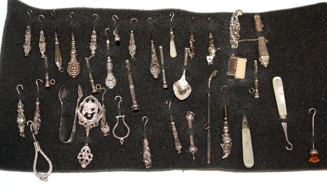 Appraisal: A COLLECTION OF APPROXIMATELY THIRTY FIVE SILVER AND OTHER BUTTON