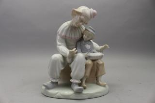 Appraisal: German Goebel Porcelain Clown and Child playing accordion Marked on