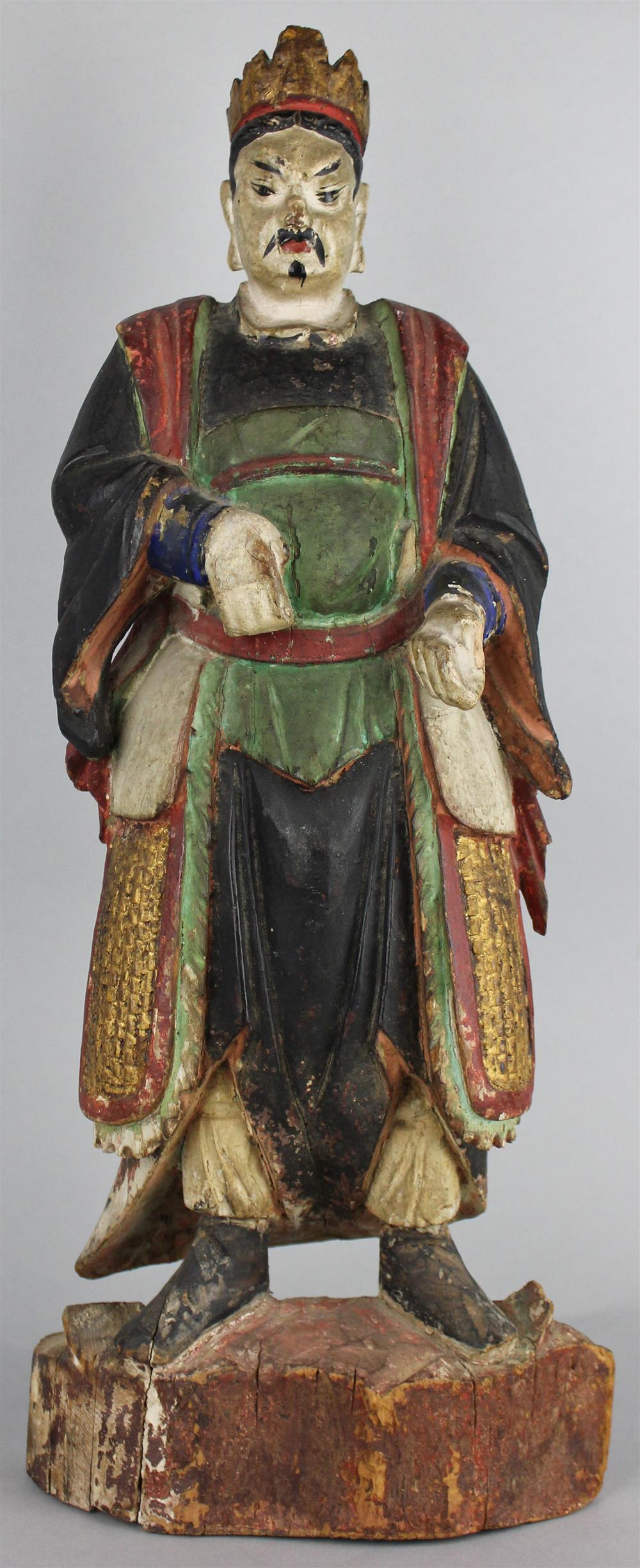 Appraisal: ASIAN POLYCHROMED AND CARVED WOODEN FIGURE OF A MAN painted