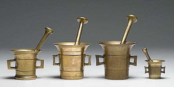 Appraisal: FOUR BRASS MORTARS AND PESTLES ranging in size from tall