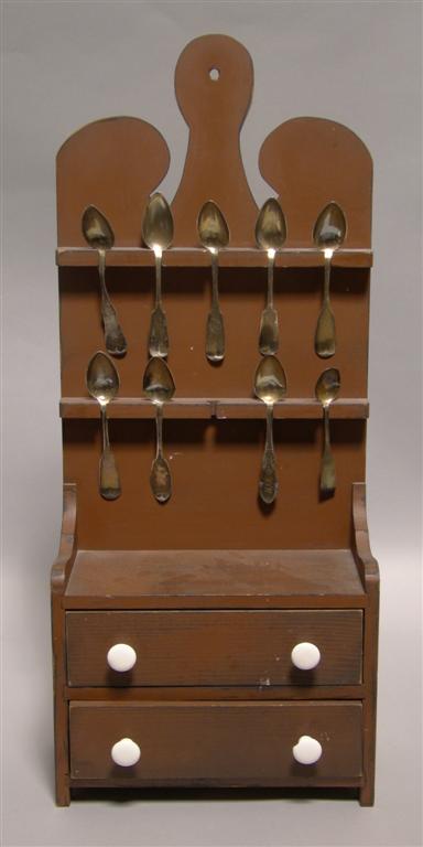 Appraisal: AMERICAN HANGING SPOON CUBBY The shaped top above two rows