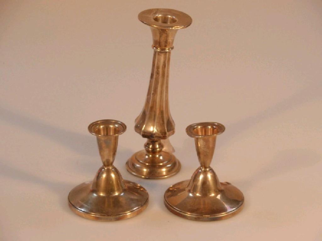 Appraisal: A pair of silver dwarf candlesticks and a spill vase