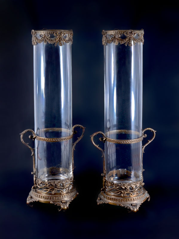 Appraisal: PAIR TALL BRASS MOUNTED GLASS CYLINDER VASES Cast brass bases