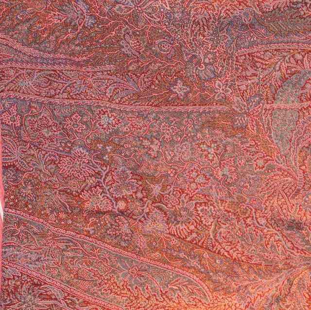 Appraisal: A KASHMIRI SHAWL with a blue green and pink foliate