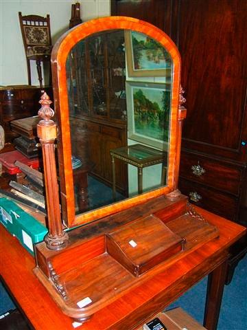 Appraisal: A Victorian walnut toilet mirror wide