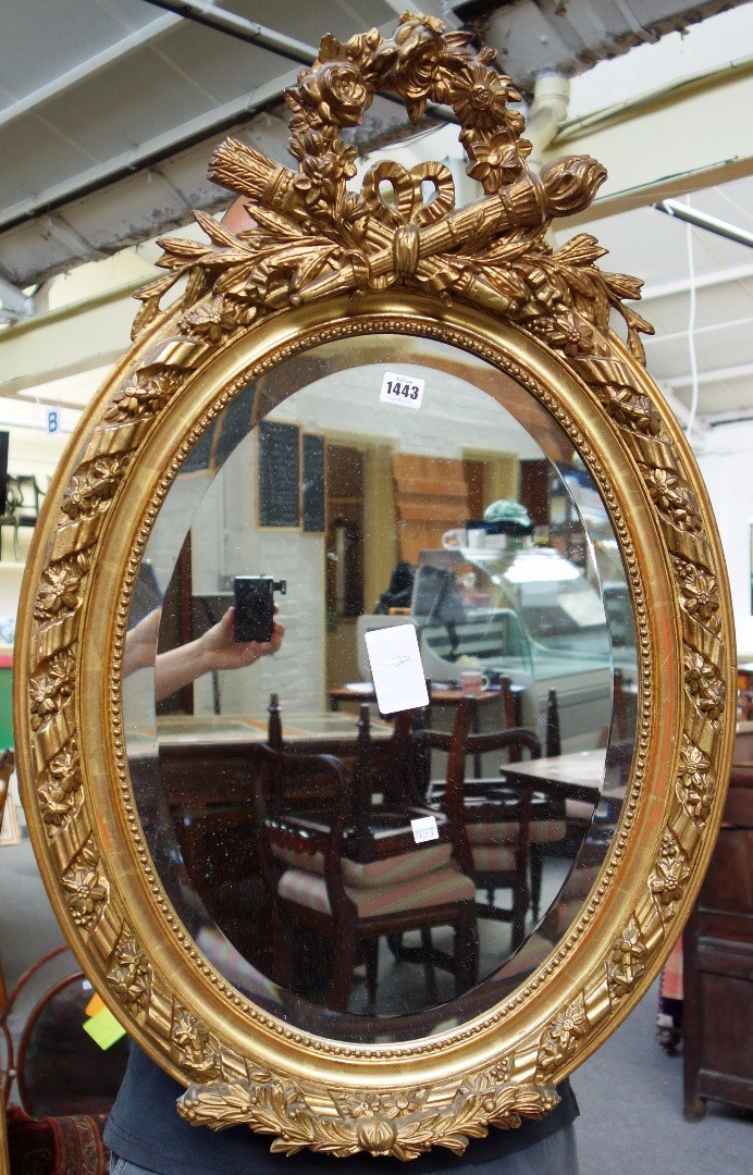 Appraisal: An early th century gilt framed oval wall mirror with