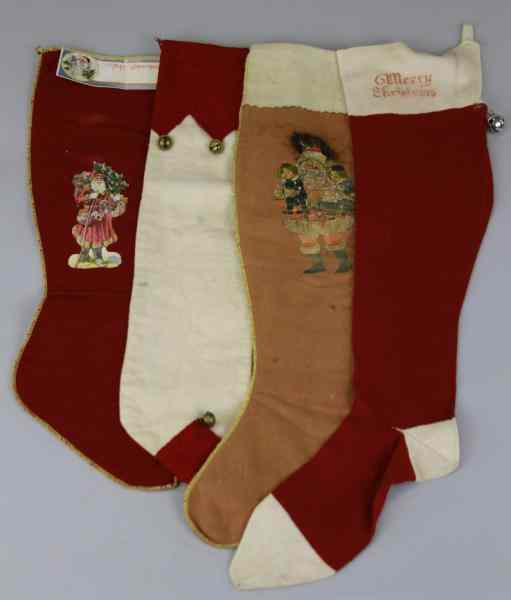 Appraisal: FOUR EARLY CHRISTMAS STOCKINGS Four early cloth children's Christmas stockings