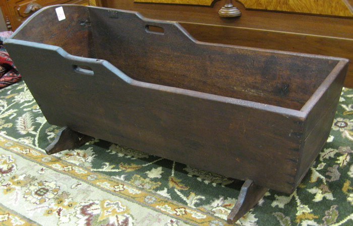 Appraisal: A ROCKING WALNUT CRADLE American th century of rectangular box