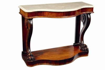 Appraisal: A George IV rosewood serpentine console table the moulded edge