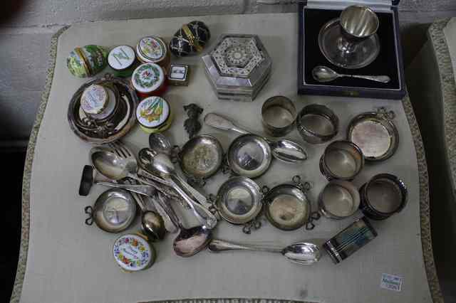 Appraisal: A QUANTITY OF ENAMELLED BOXES napkin rings two silver egg