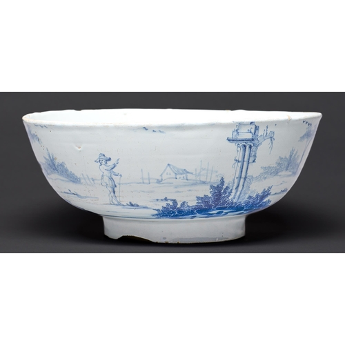 Appraisal: An English delftware punch bowl London c - painted to