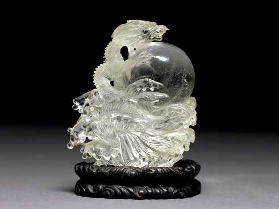 Appraisal: CRYSTAL BALL WITH CELESTIAL DRAGON A finely carved Chinese quartz