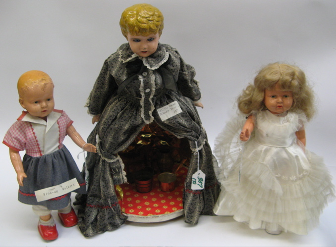 Appraisal: THREE COLLECTIBLE DOLLS two are mechanical walkers with celluloid heads