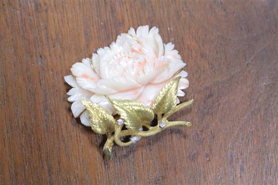 Appraisal: CORAL GOLD AND DIAMOND BROOCH Angelskin coral brooch carved in