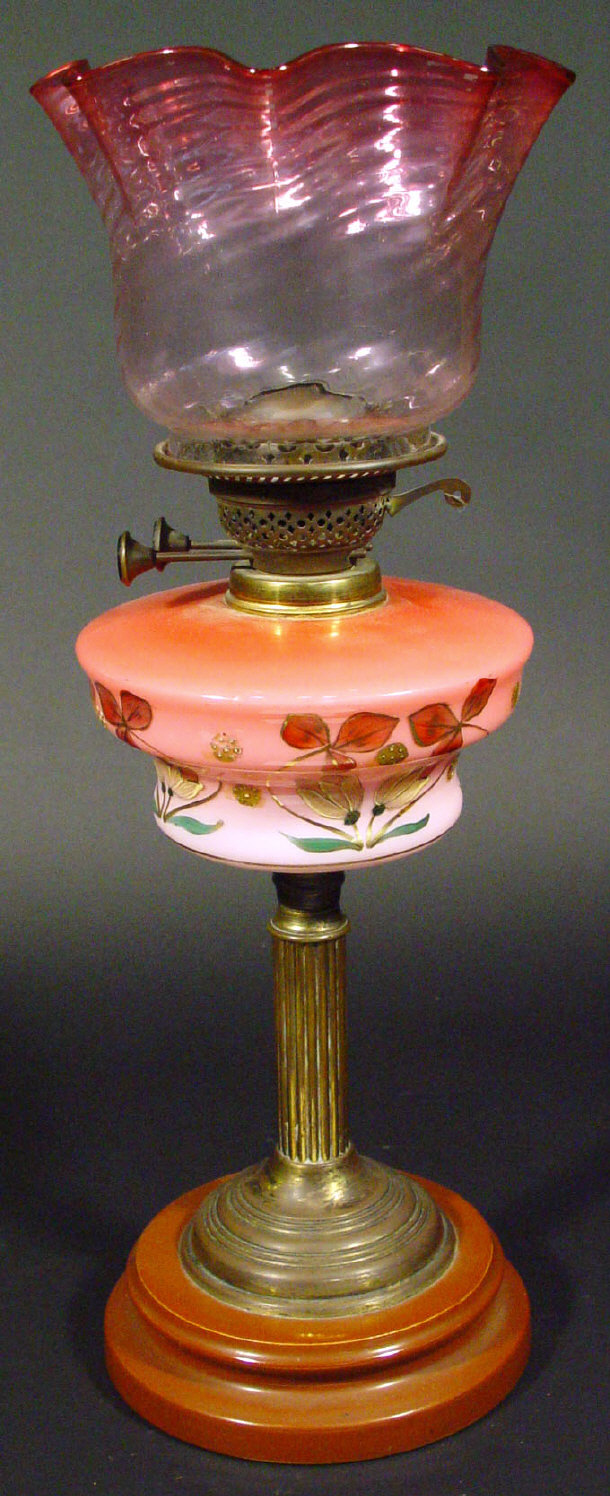 Appraisal: Victorian brass oil lamp the pink glass reservoir enamelled with