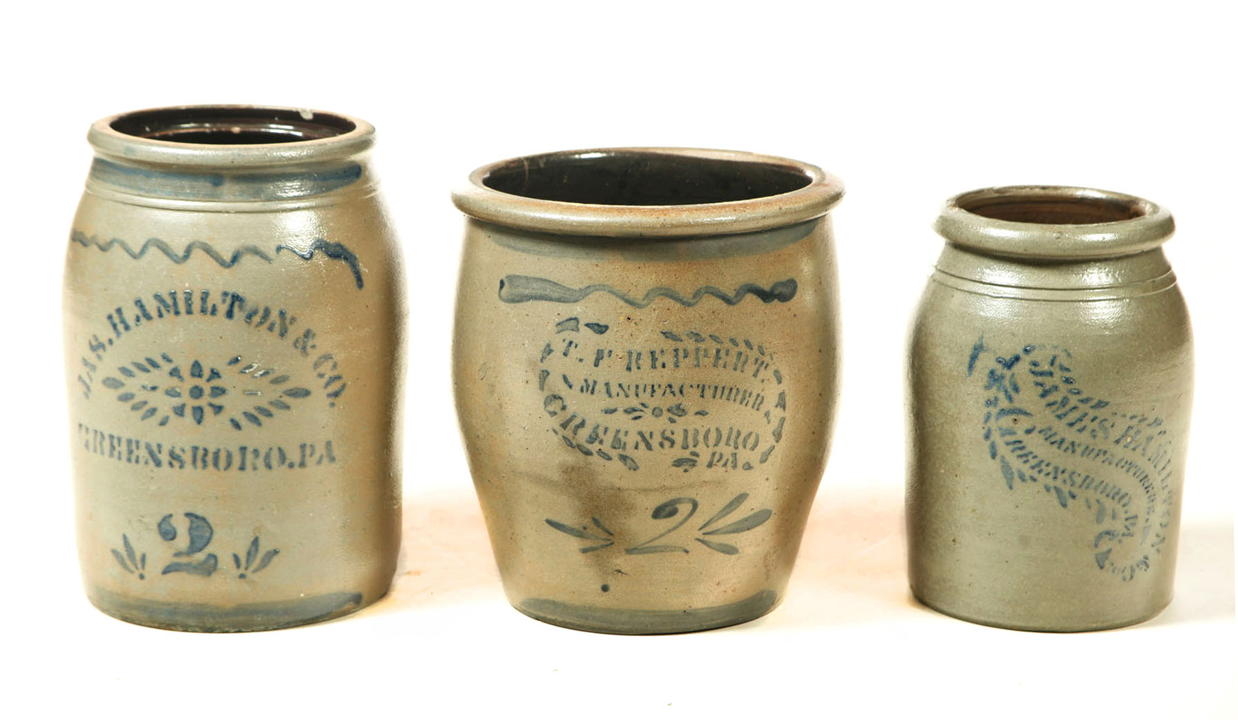 Appraisal: THREE DECORATED STONEWARE CROCKS All are Greensboro Pennsylvania rd quarter-