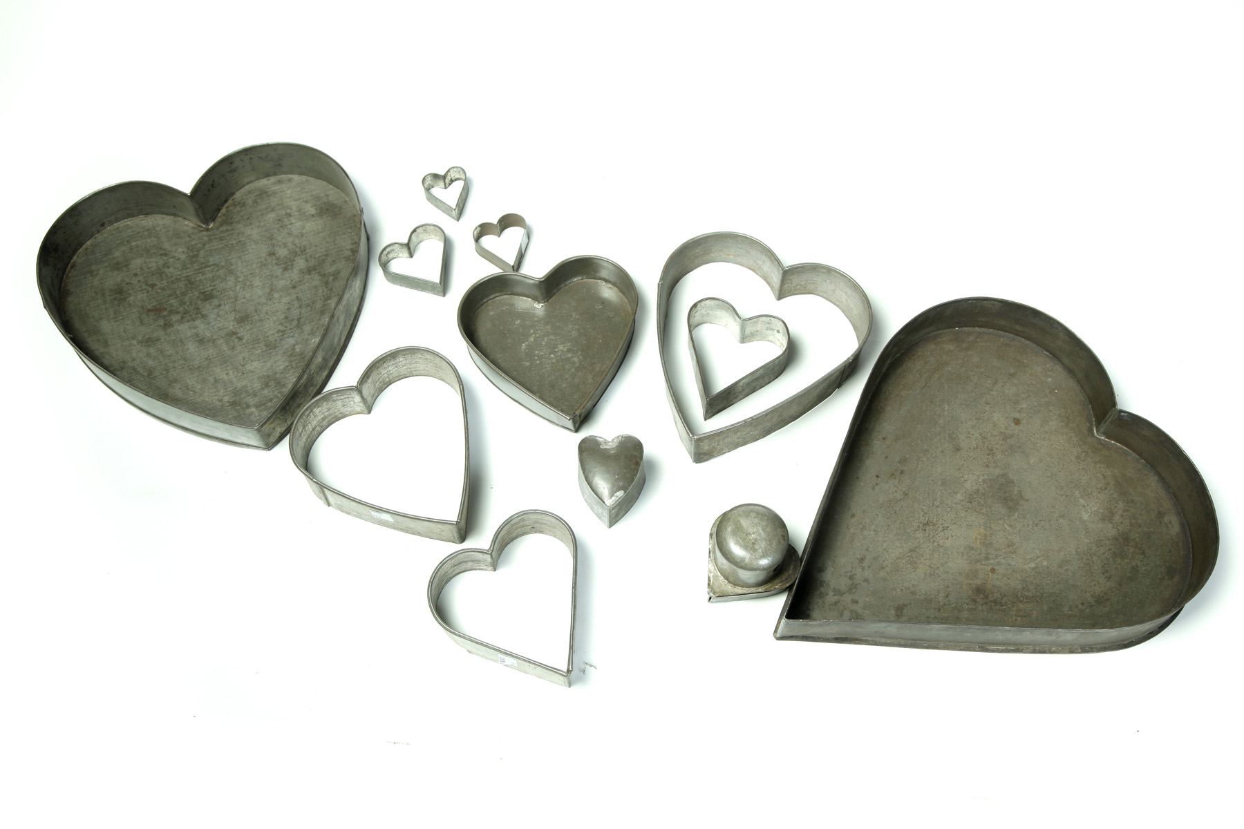 Appraisal: TWELVE AMERICAN TIN HEART MOLDS Late th- th century Ten