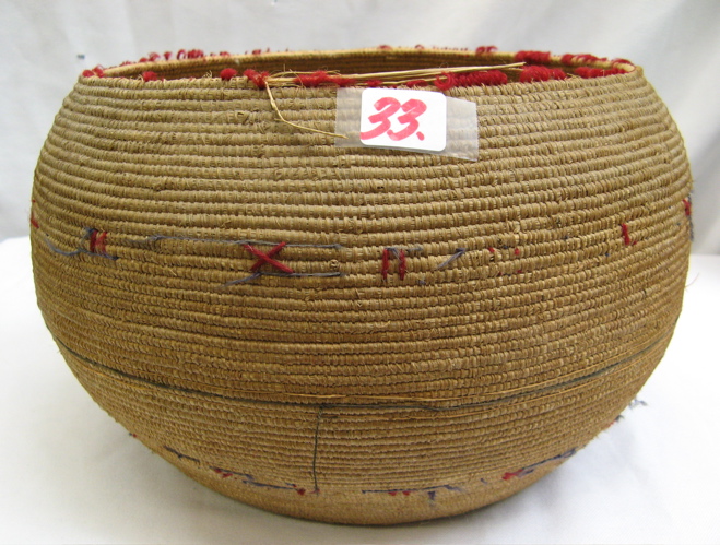 Appraisal: AN ALASKAN ESKIMO INDIAN COILED BASKET decorated with traces of