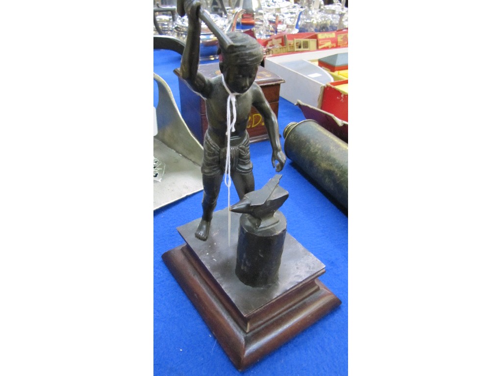 Appraisal: Bronze figure of an eastern blacksmith