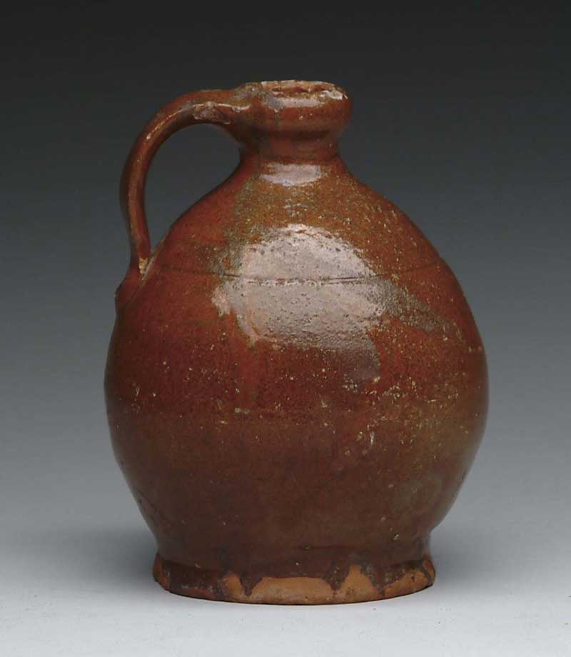 Appraisal: SMALL GLAZED MAINE REDWARE JUG ATTRIBUTED TO NORCROSS POTTERY Small